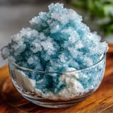 Vibrant TikTok Cloud Slushie in tall glasses, topped with a creamy swirl of sweetened condensed milk.