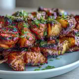 Colorful skewers of marinated chicken and pineapple, grilled until charred and bursting with sweet-savory flavor.