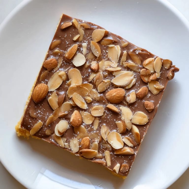 Delicious, richly-sweet English toffee, featuring a layer of milk chocolate and crunchy almonds.